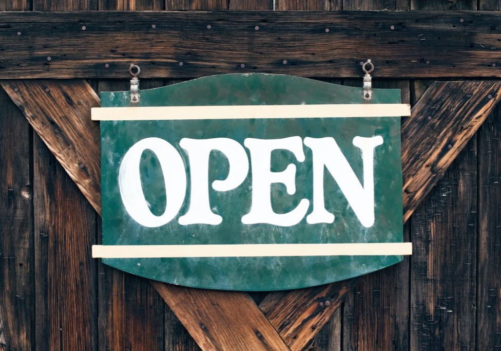 green and white open signage